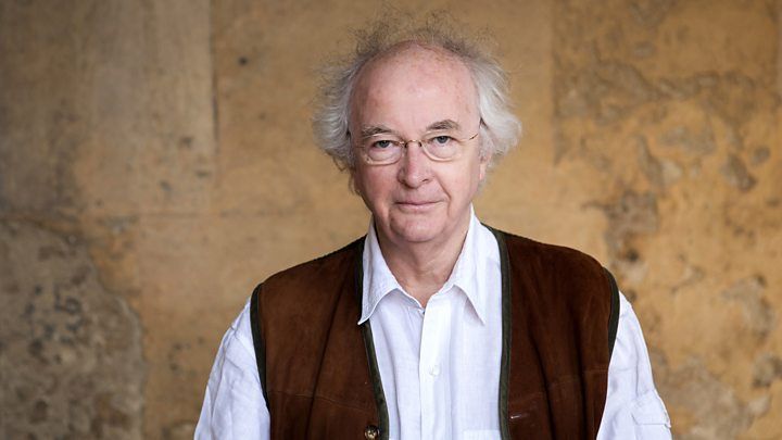 Photograph of Sir Philip Pullman wearing a nut-brown waistcoat.