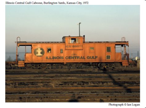 In this colour photograph taken in 1972 by the railfan designer Ian Logan, a conductor with a dark blue cap rides the caboose at the end of a Chicago-New Orleans train of the Illinois Central Gulf Railroad.