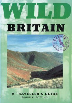 The green front cover of Wild Britain features a dramatic view over a moor.