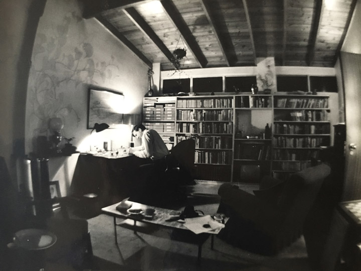 Black and white photo of Douglas Botting at his desk in the 1950s.