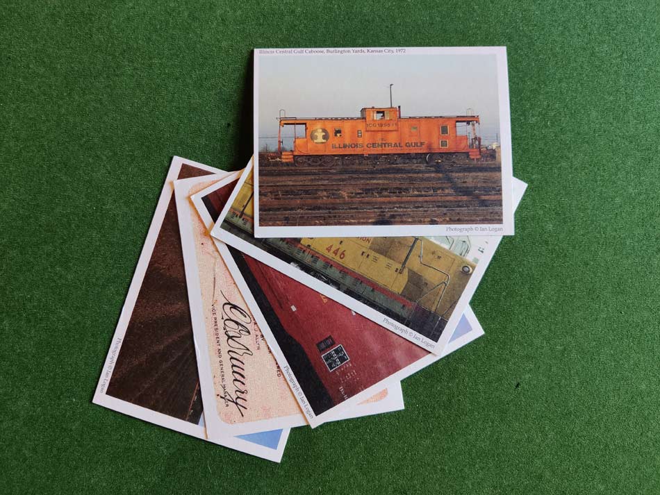 This colour image shows five railway-themed postcards on a green background arranged in a fan from top right to bottom left.