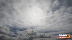 In this colour screenshot, the sun shines through a thin layer of cloud, creating dark bellies on some of the thicker ones.
