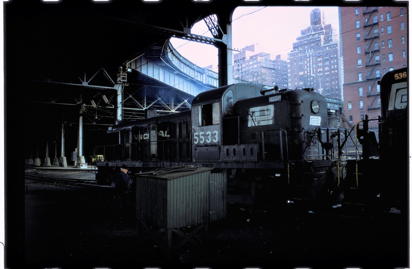 Colour photograph taken by Ian Logan in the 1970s of a Penn Central diesel locomotive in the West 60th Street yard in Manhattan.