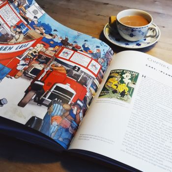 Very Heath Robinson lies on a table open at the beginning of Chapter 6 with a colour illustration of two buses.